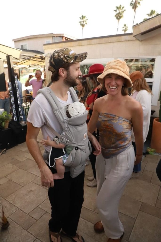 A couple with their baby at a coffee shop