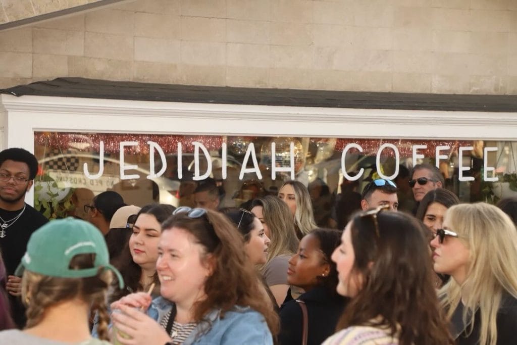 People dancing at a coffee shop party