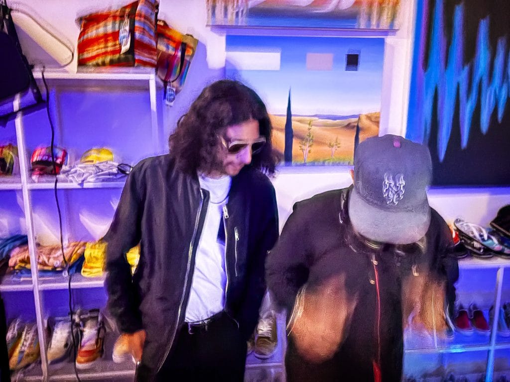 Two men DJ in a store