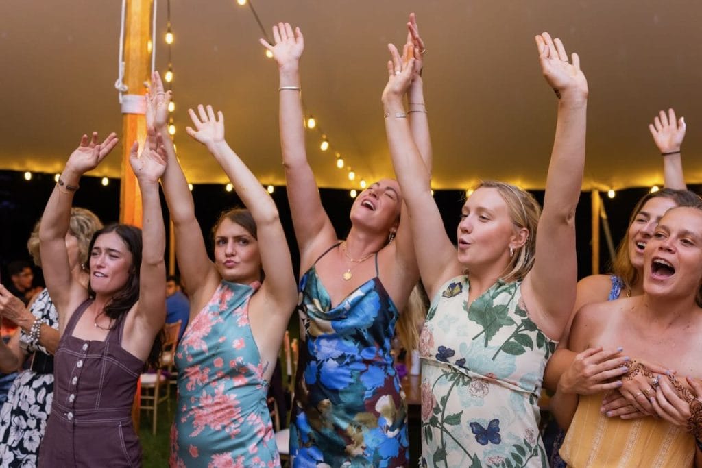 A group of women dancing at a wedding reception