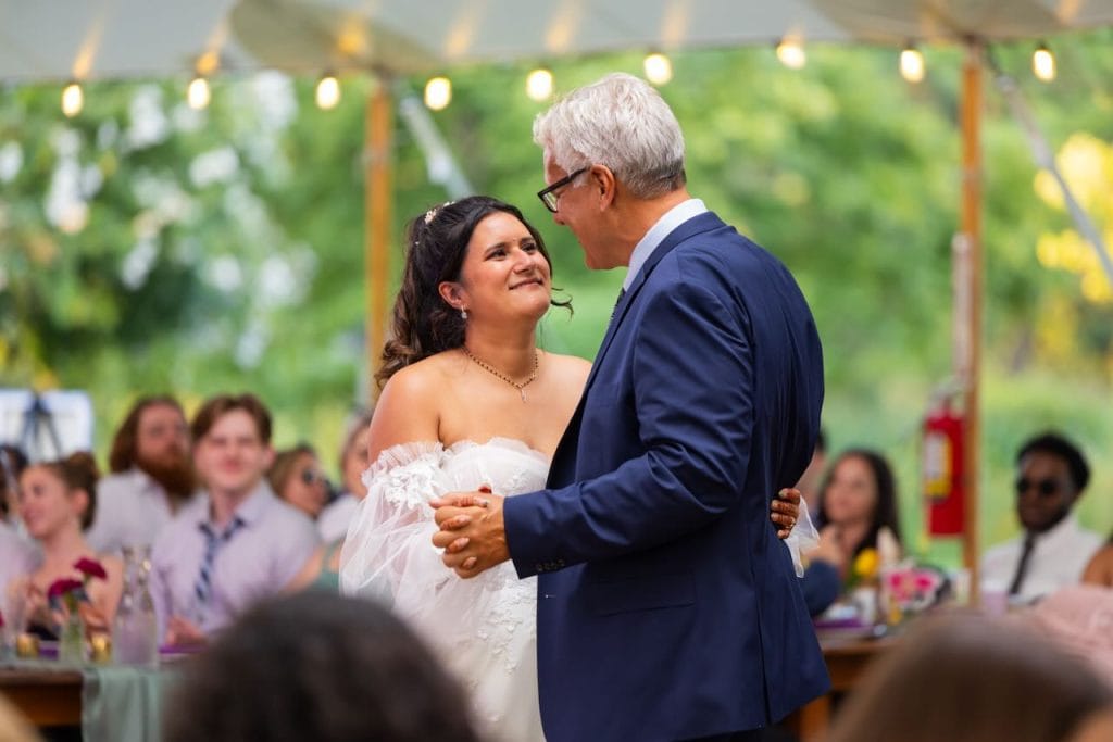 Father daughter dance at an outdoor reception