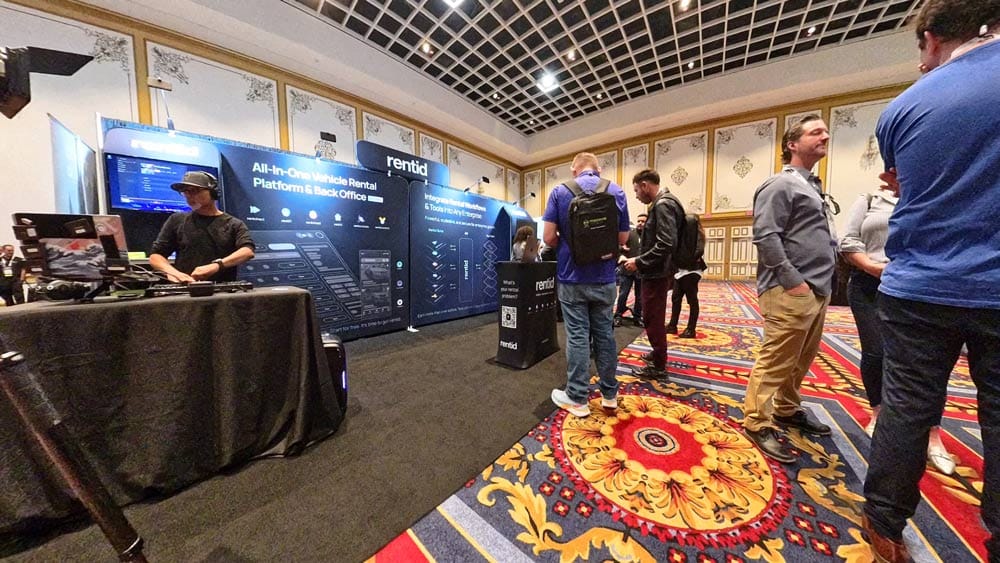 expo room with a DJ at a booth