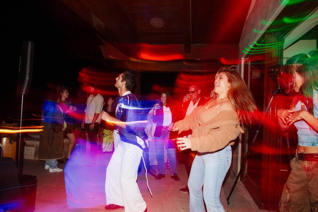 Motion blur of people dancing at a wedding