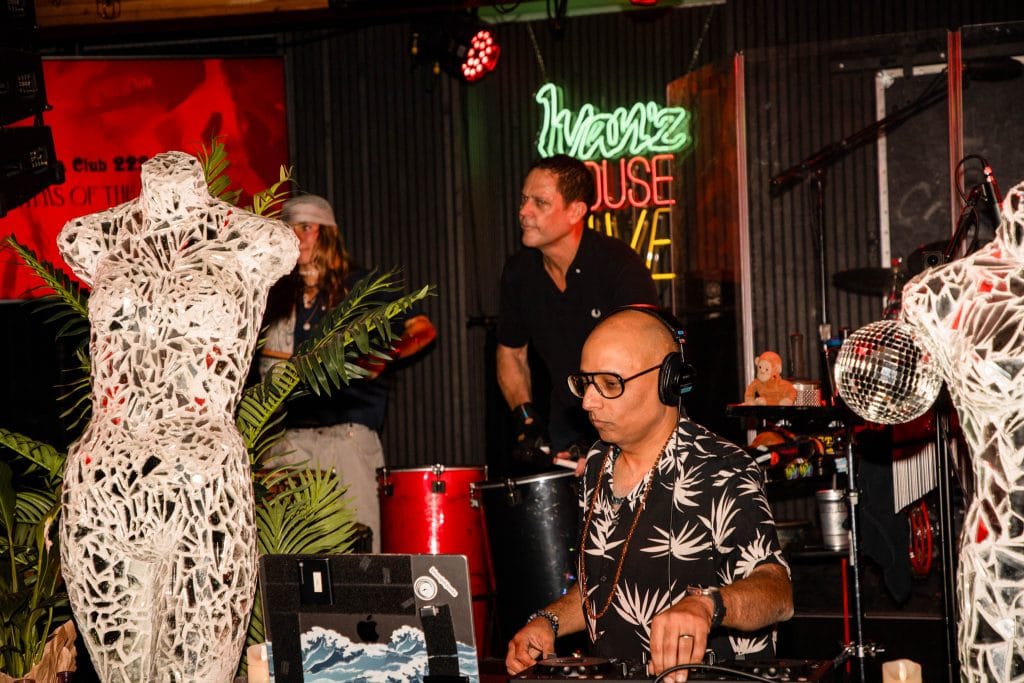 DJ with drummers at a party