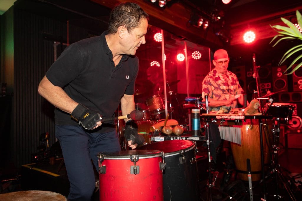 Drummers playing at a party with a DJ